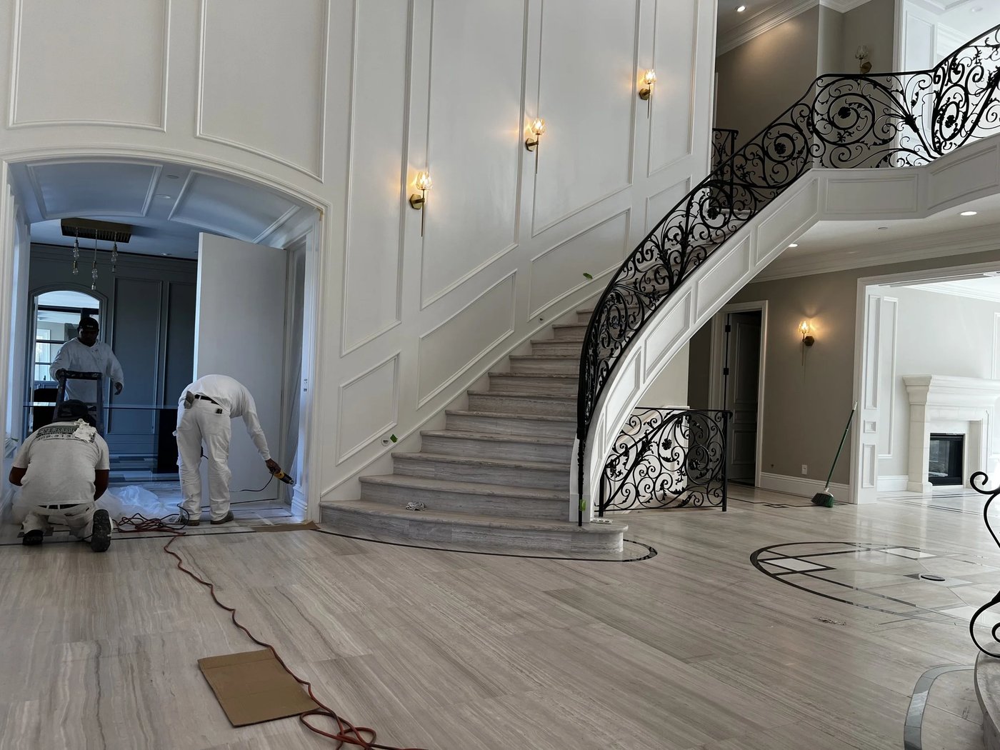Interior entry and curved staircase mid-project