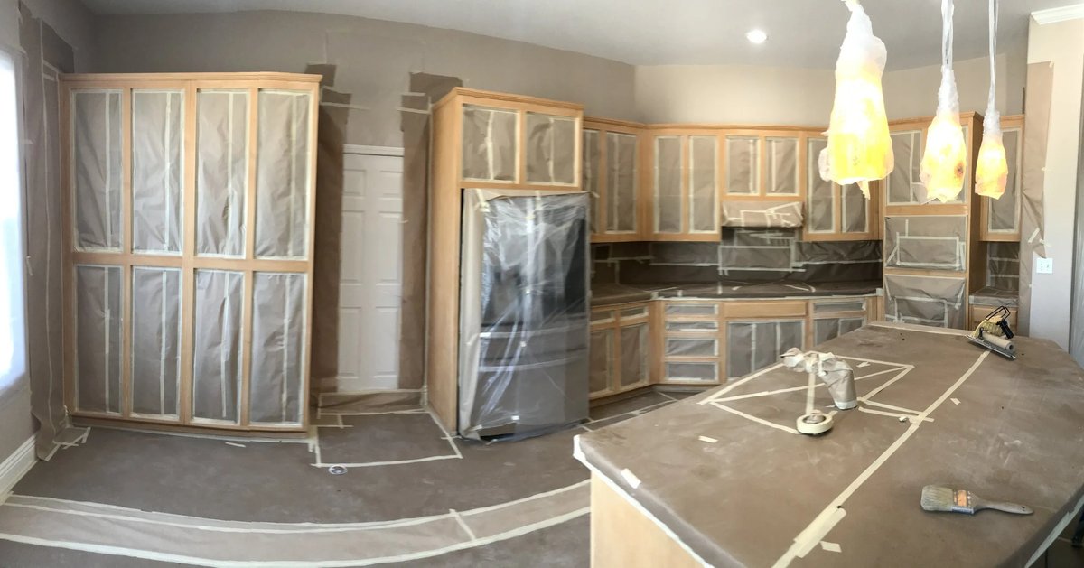 Kitchen cabinets masked off and prepped for refinishing